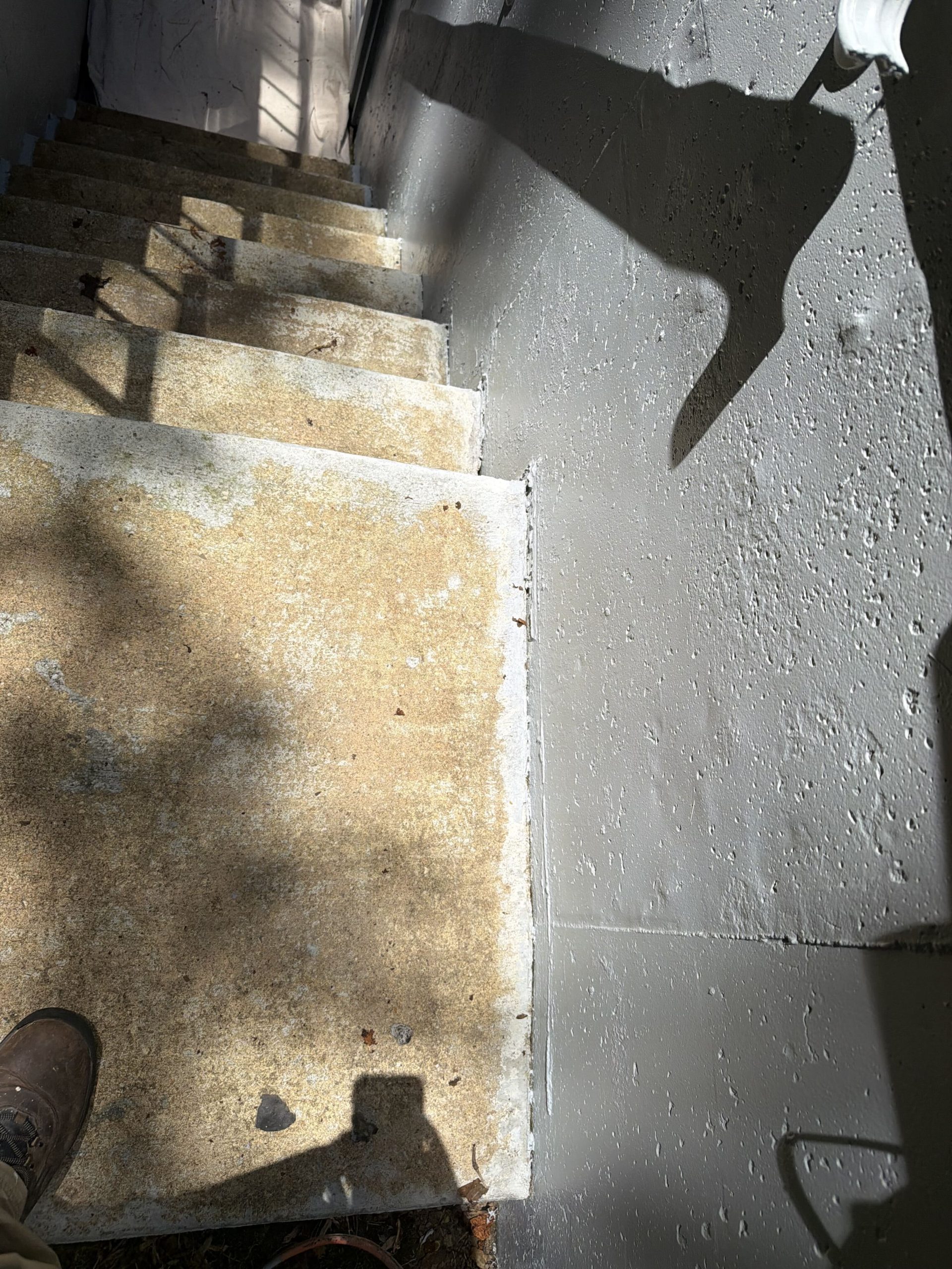 Before and after concrete stairs painting in progress