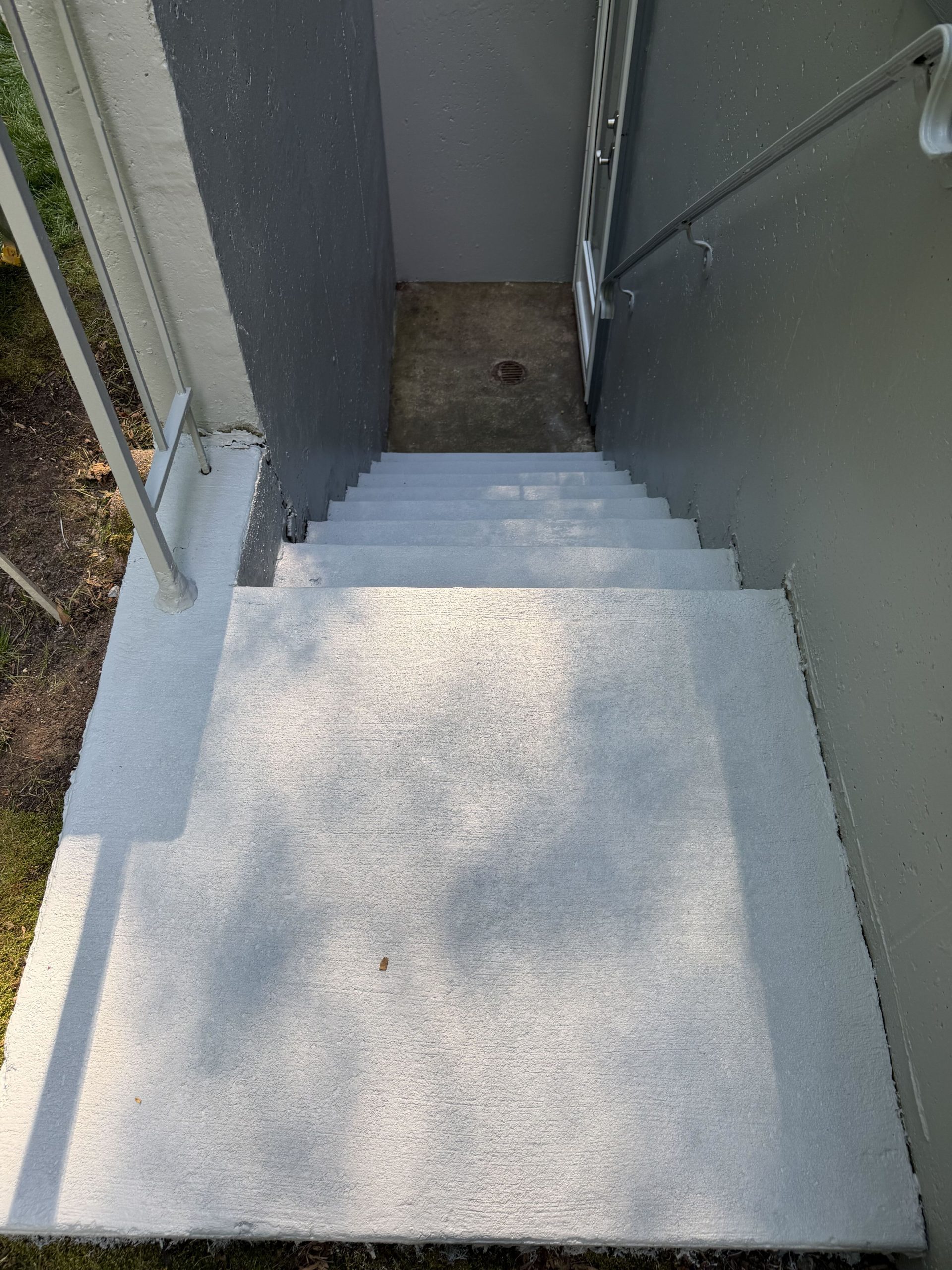 Concrete stair surround after painting - crisp clean finish