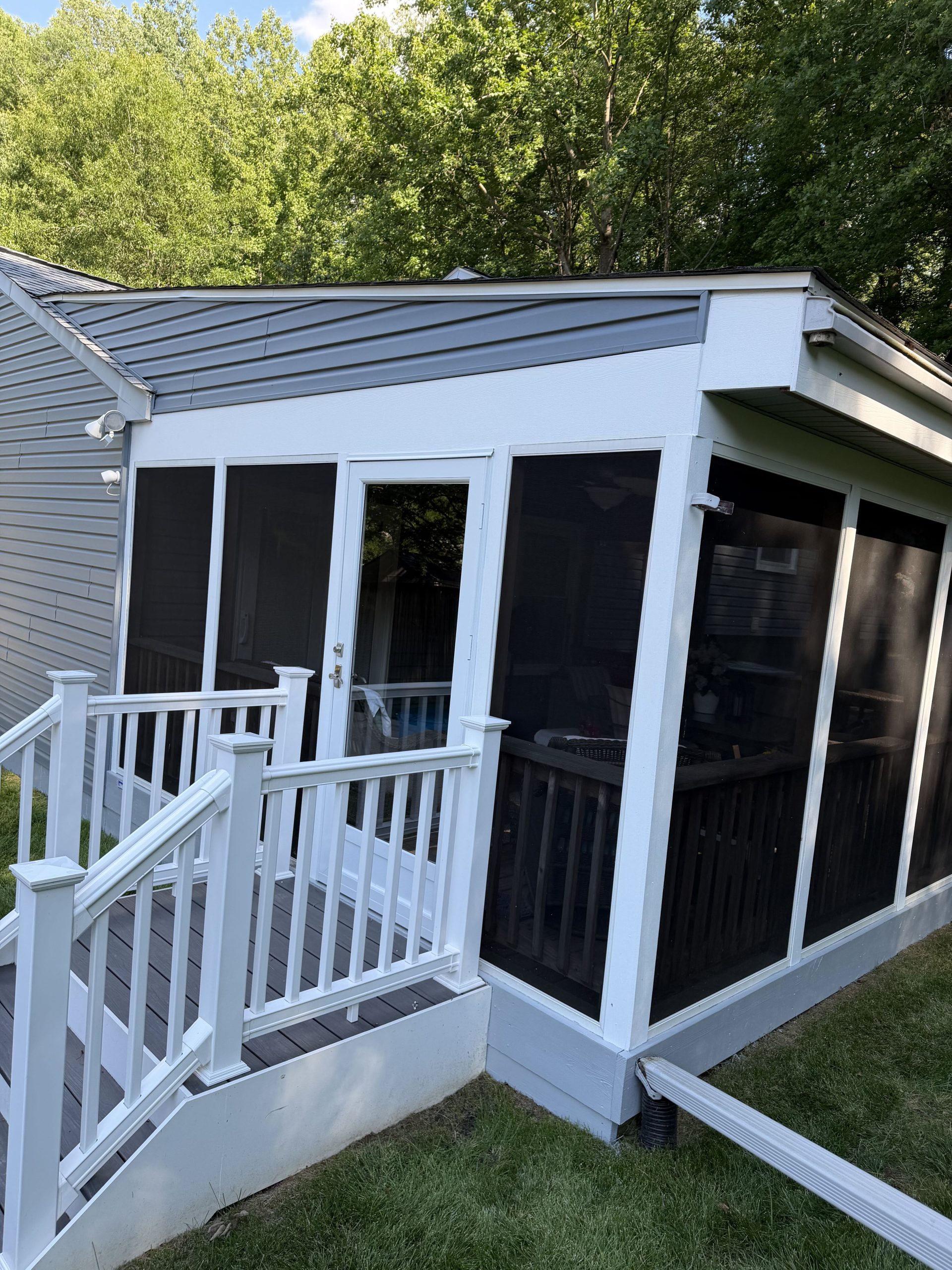 Screened porch after painting - fresh white trim by ARM Premium Painting Upper Marlboro MD