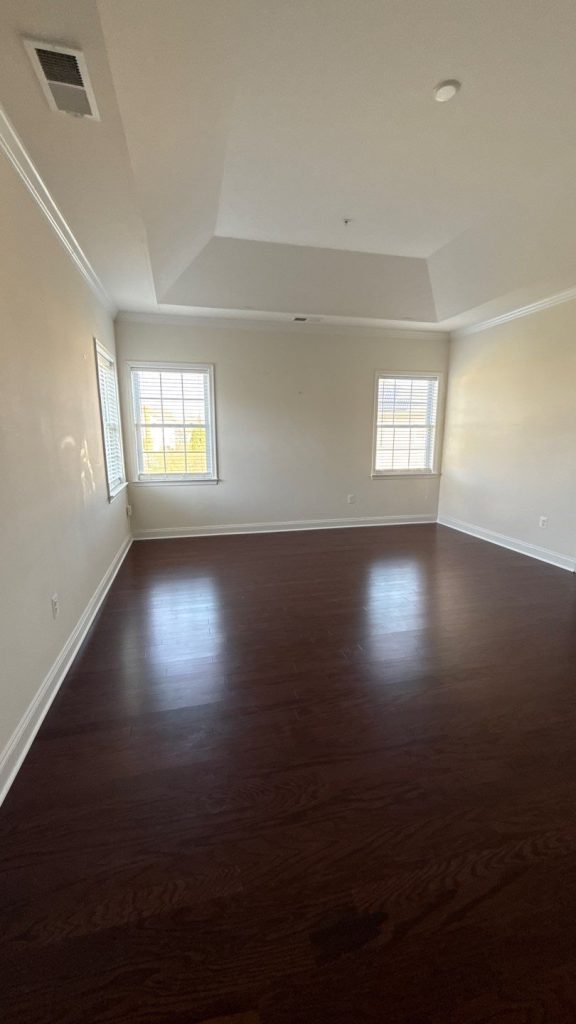 After interior painting in Upper Marlboro, MD - freshly painted primary suite with crown molding