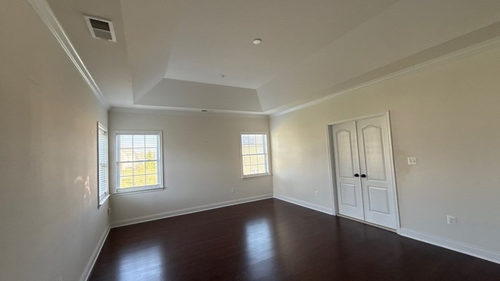 Freshly painted bedroom with crisp trim after interior painting in Upper Marlboro, MD