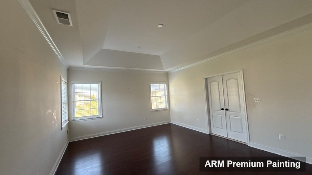 Freshly painted bedroom with crisp white trim after an interior repaint in Upper Marlboro, MD