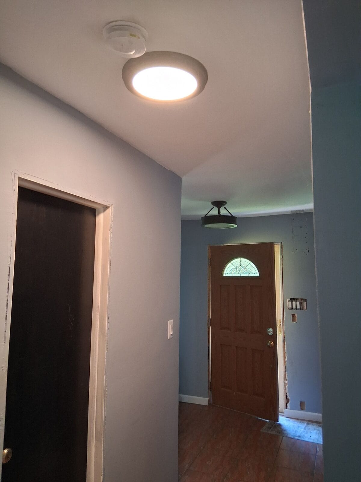 Finished hallway walls and ceiling after drywall repair and painting