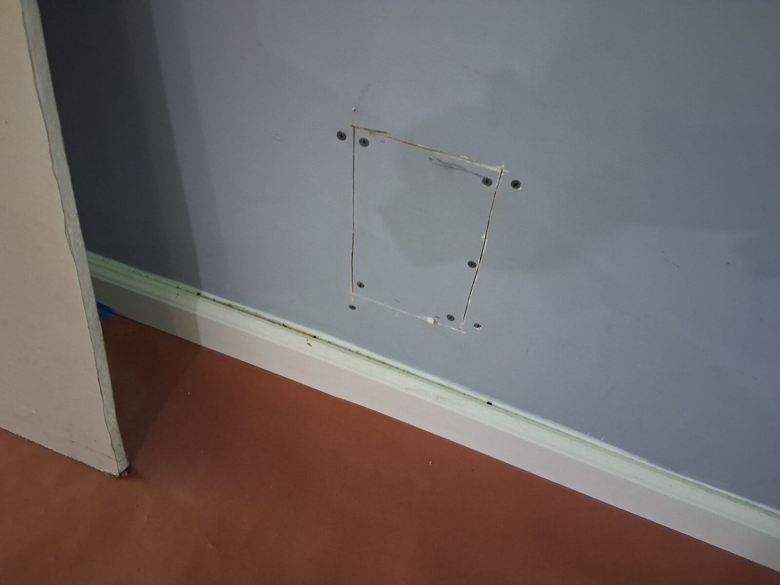 Taped and floated drywall patch ready for primer and paint