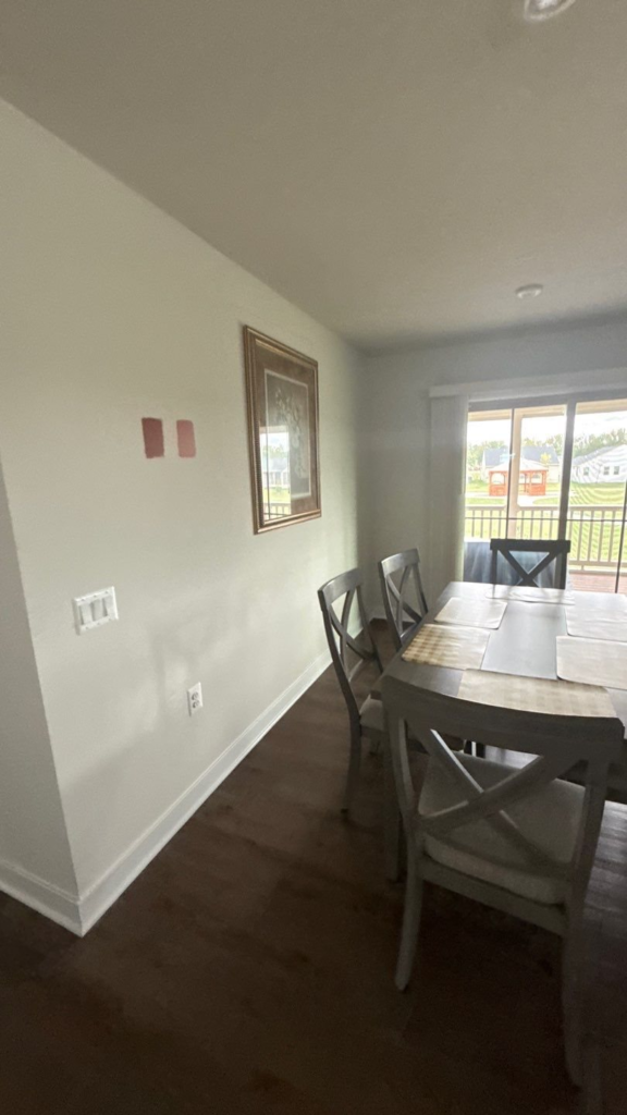 Dining area in an open-concept layout, painted to match the living room